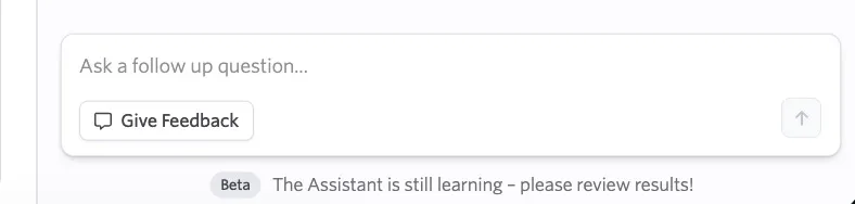Screenshot of the Give Feedback dialog in the AI Reporting Assistant showing rating options and a comment field