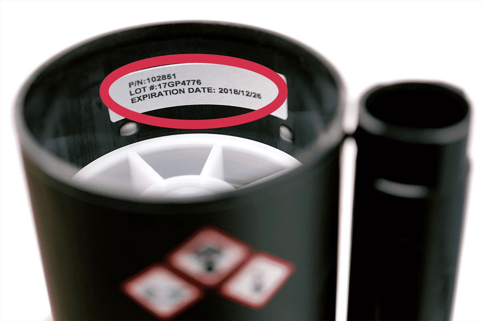 Lot number and expiration date displayed inside a cannister on a cartridge