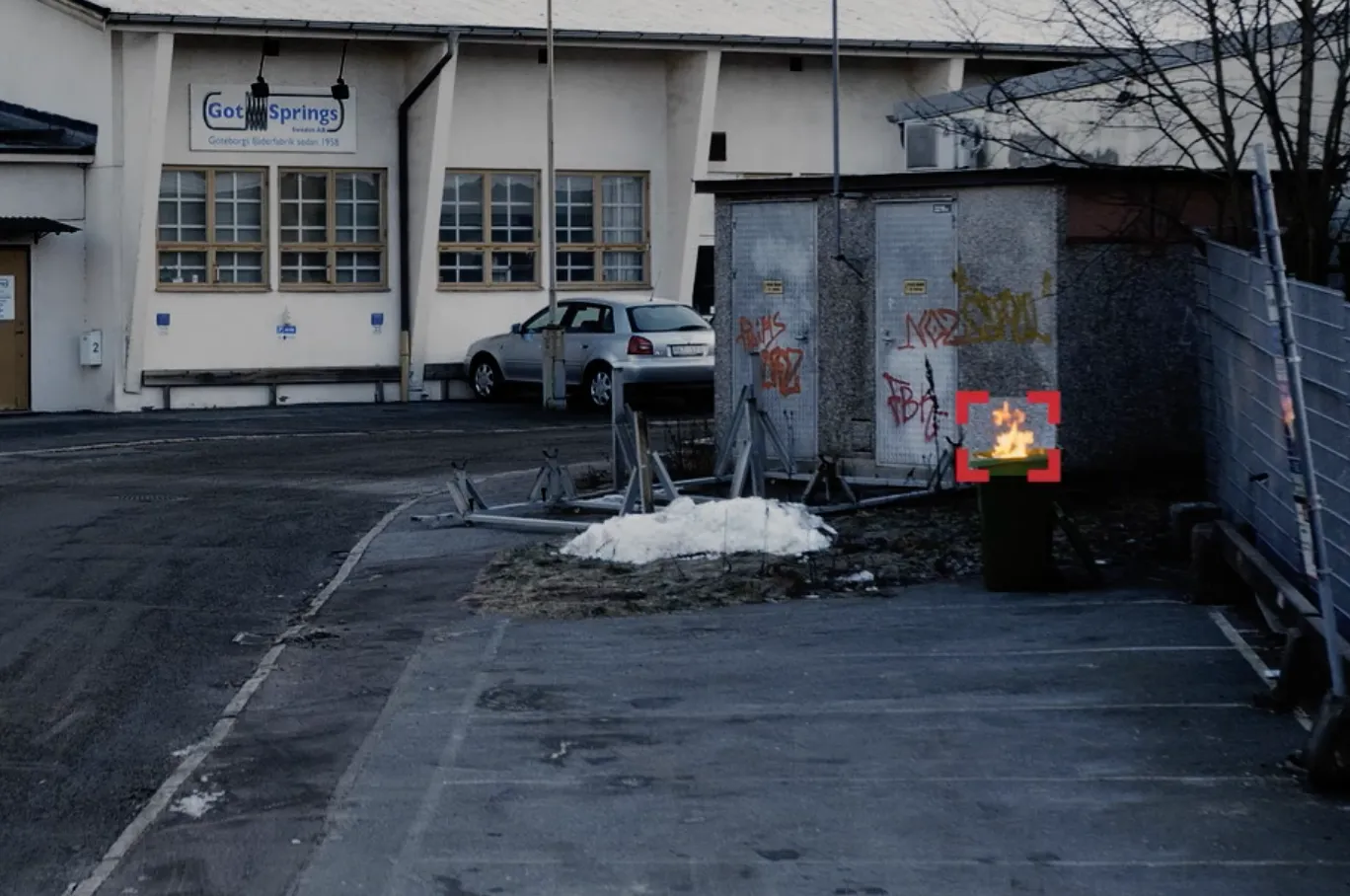 A detected fire in an outdoor scene.
