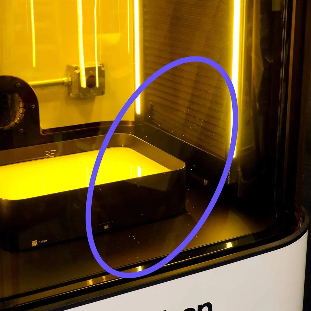Static charge pulled resin drips onto the printer door Static charge pulled resin drips onto the printer door